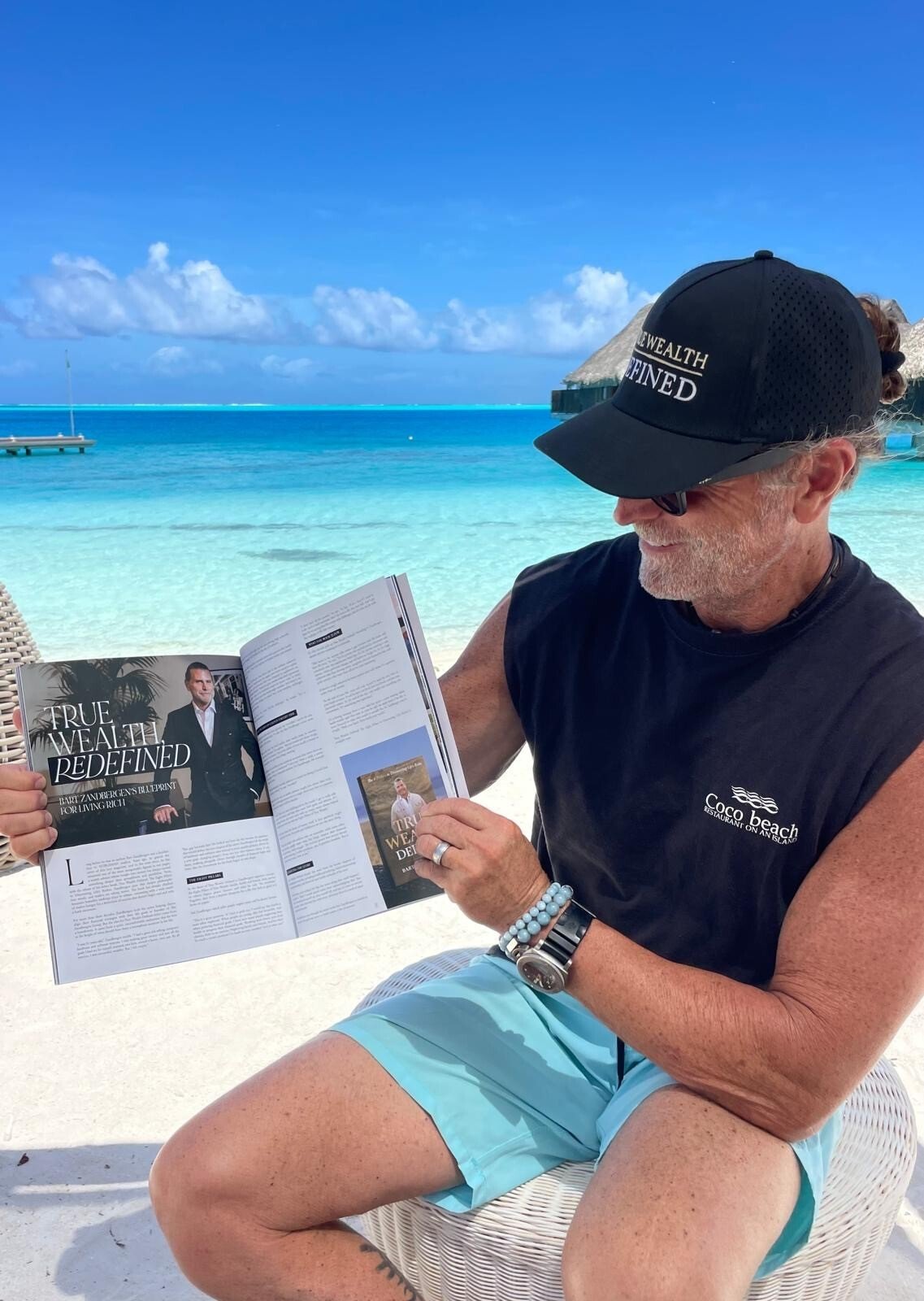 Bart Zandbergen reading his True Wealth Redefined feature in Nobleman Magazine